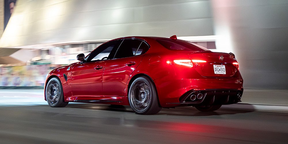 Rear 3/4 shot of a red Giulia QV