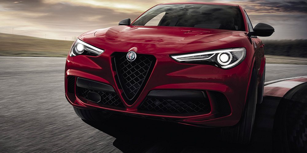 Red Stelvio QV driving on a track