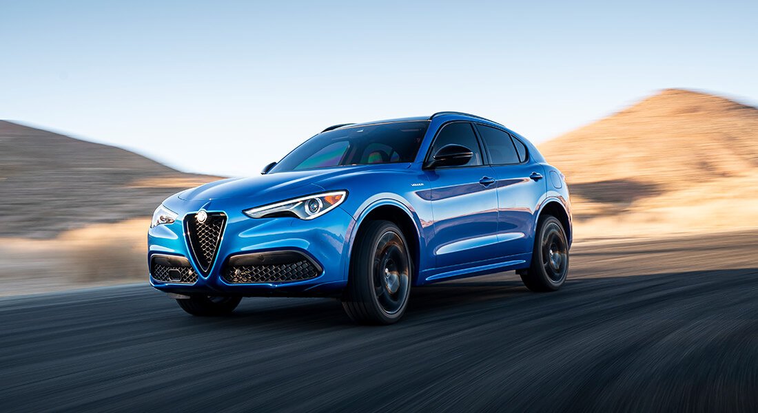 Front 3/4 shot of a Stelvio driving in a desert