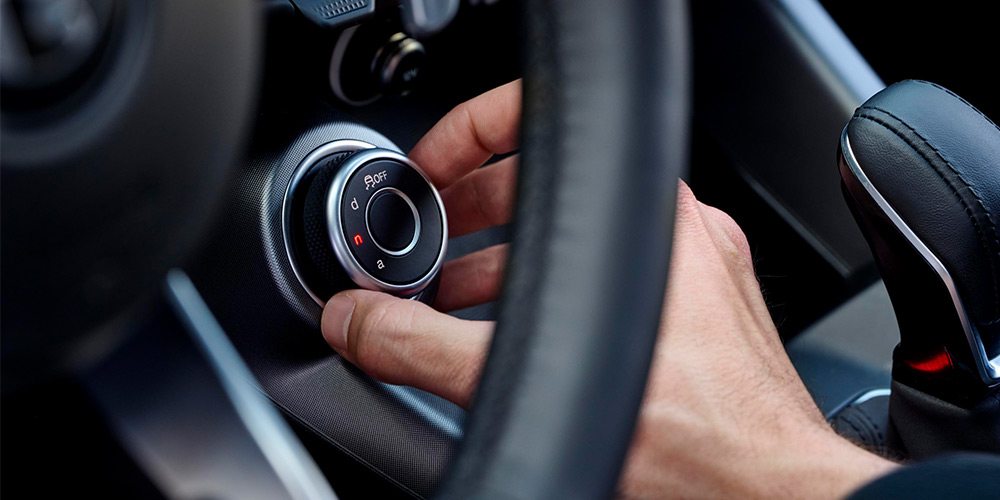 Suspension switch being turned in an Alfa Romeo